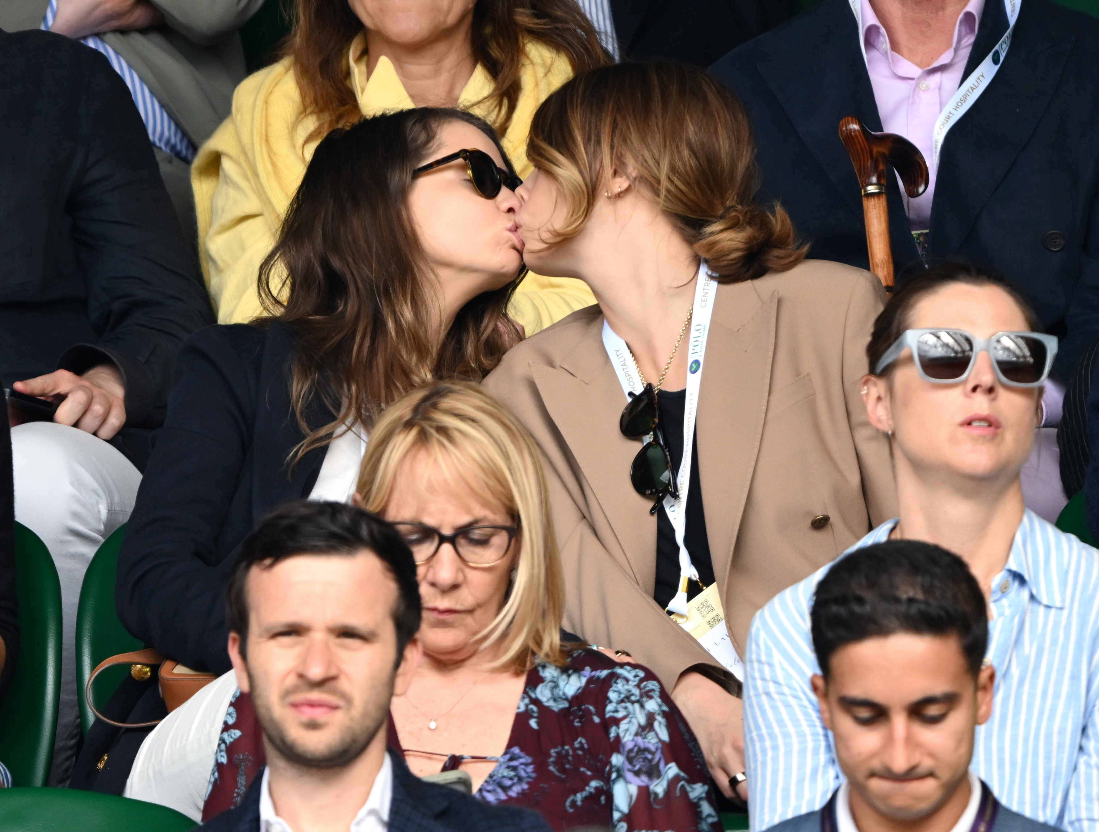Minke and Cara Delevingne kissing in a crowd