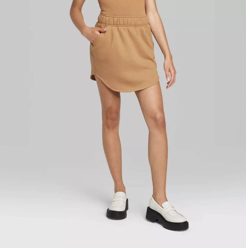 Model in Women&#x27;s Fleece Mini Skirt - Wild Fable™ in light brown