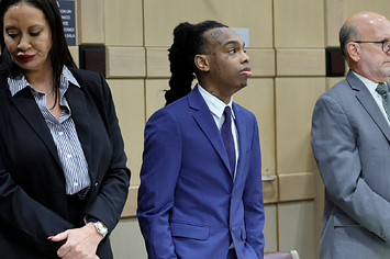 YNW Melly stands with his attorneys,Raven Ramona Liberty, left, and Stuart Adelstein, right, as jurors enter the courtroom for closing arguments in his trial