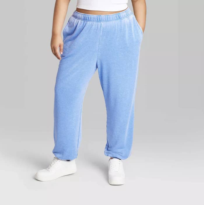 Model in Women&#x27;s Tapered Perfect Sweatpants - Wild Fable™ in blue