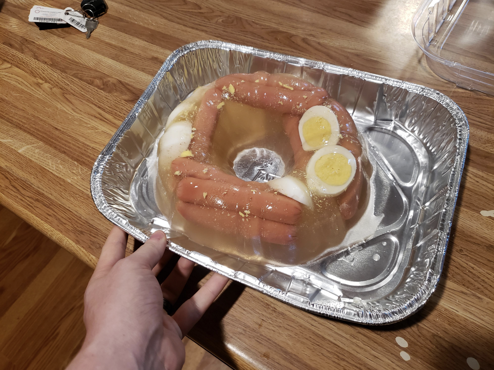 The hot dogs, gelatin, and hard-boiled eggs are all wrapped in plastic together, making them looking one disgusting mass