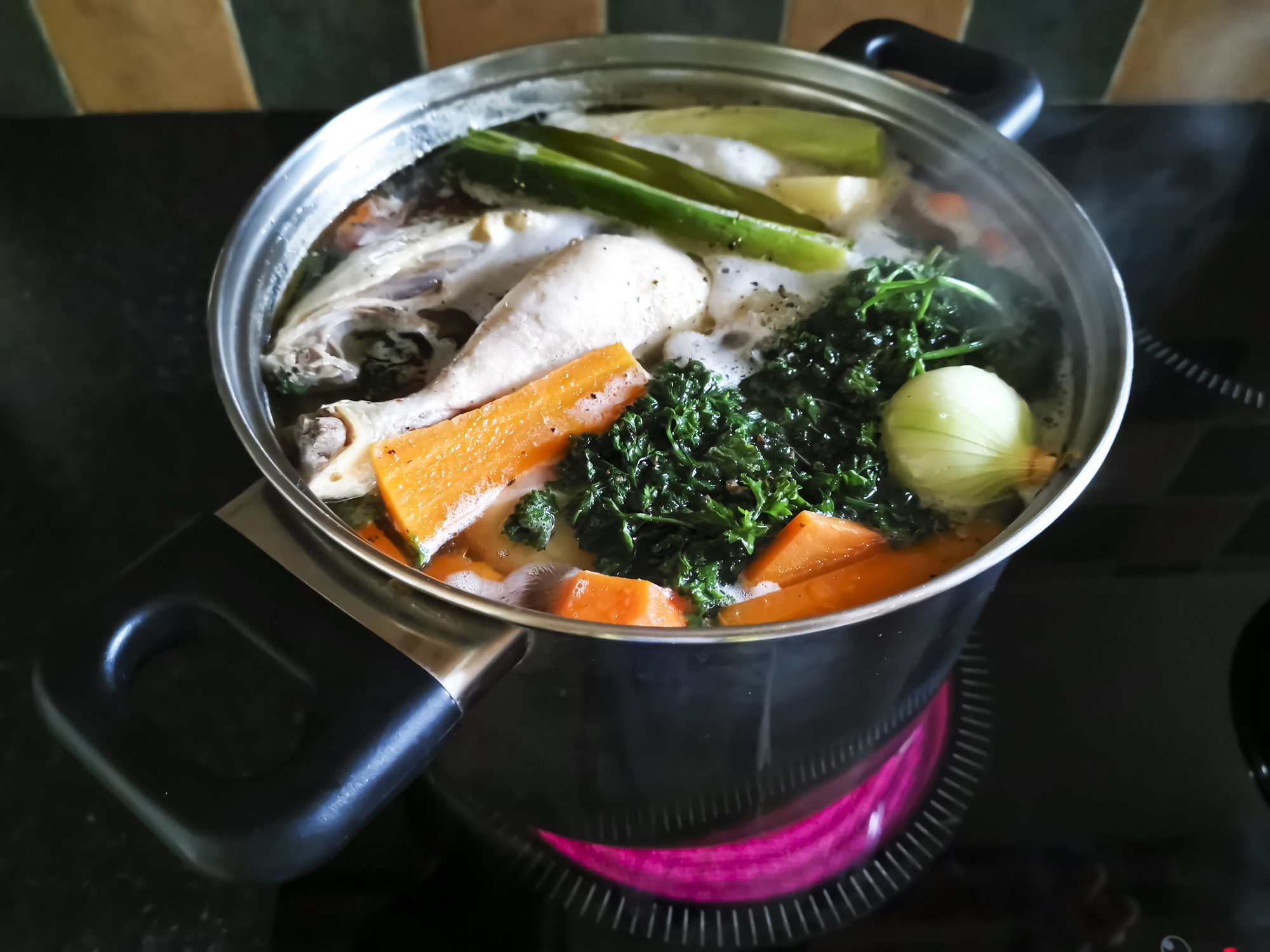 Veggie and chicken stock in a pot