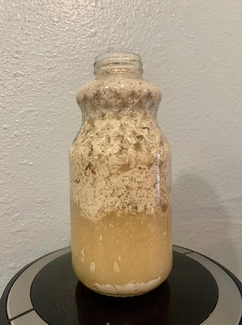 This creation has separated in a jar, with liquid at the bottom and whatever was supposed to be mixed into it rising to the top