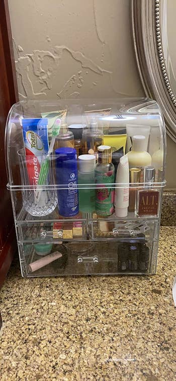a reviewer's cosmetic organizer on their bathroom counter