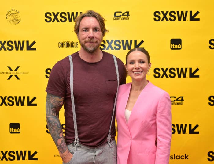 Dax and Kirsten pose for photographers at a media event