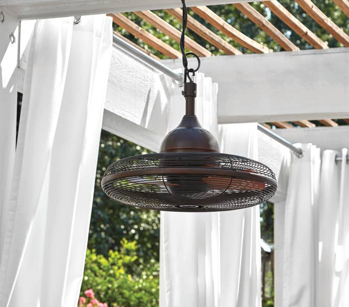 bronze caged ceiling fan hanging outside