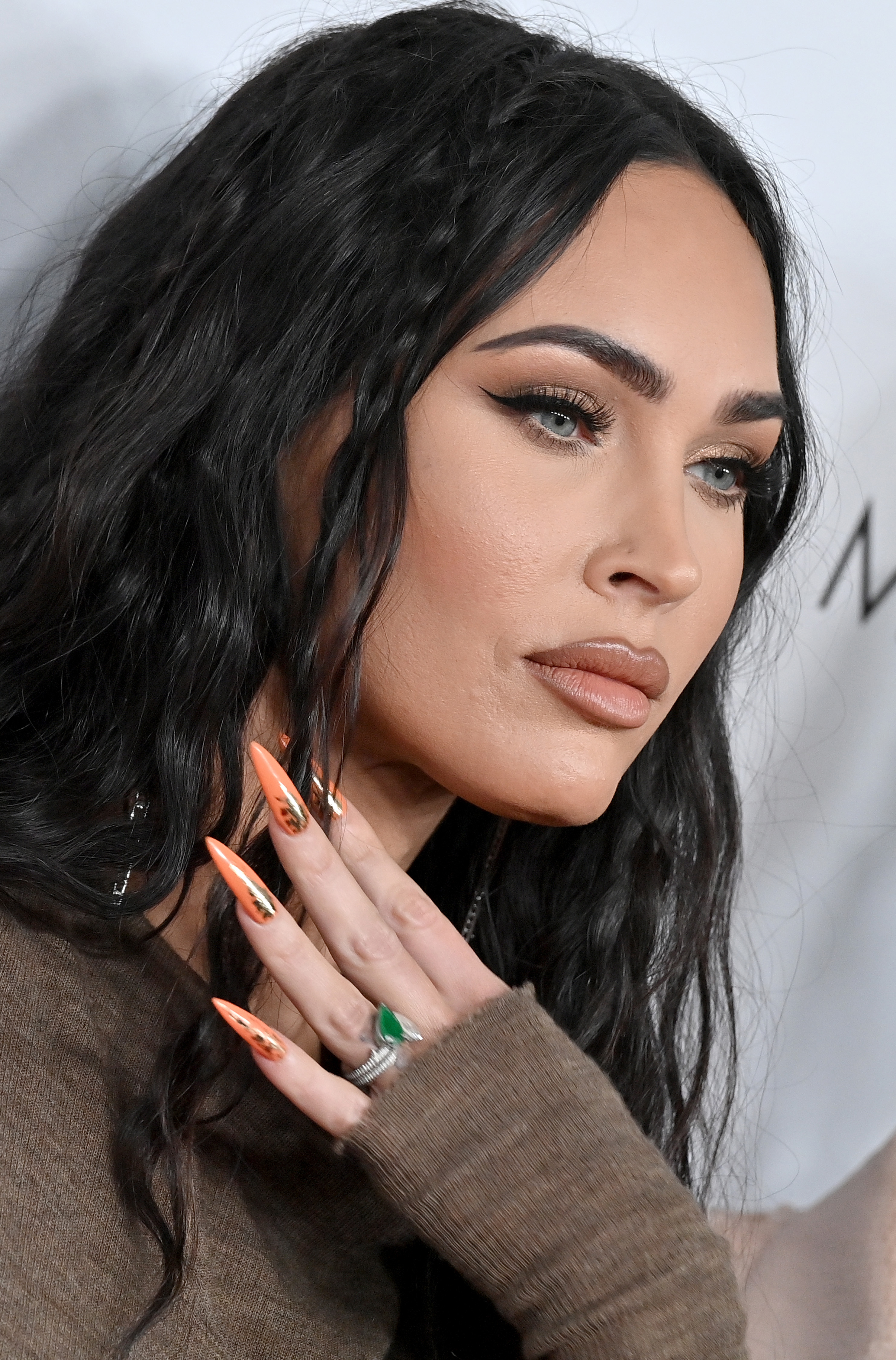 Closeup of Megan Fox showing off her long manicured nails