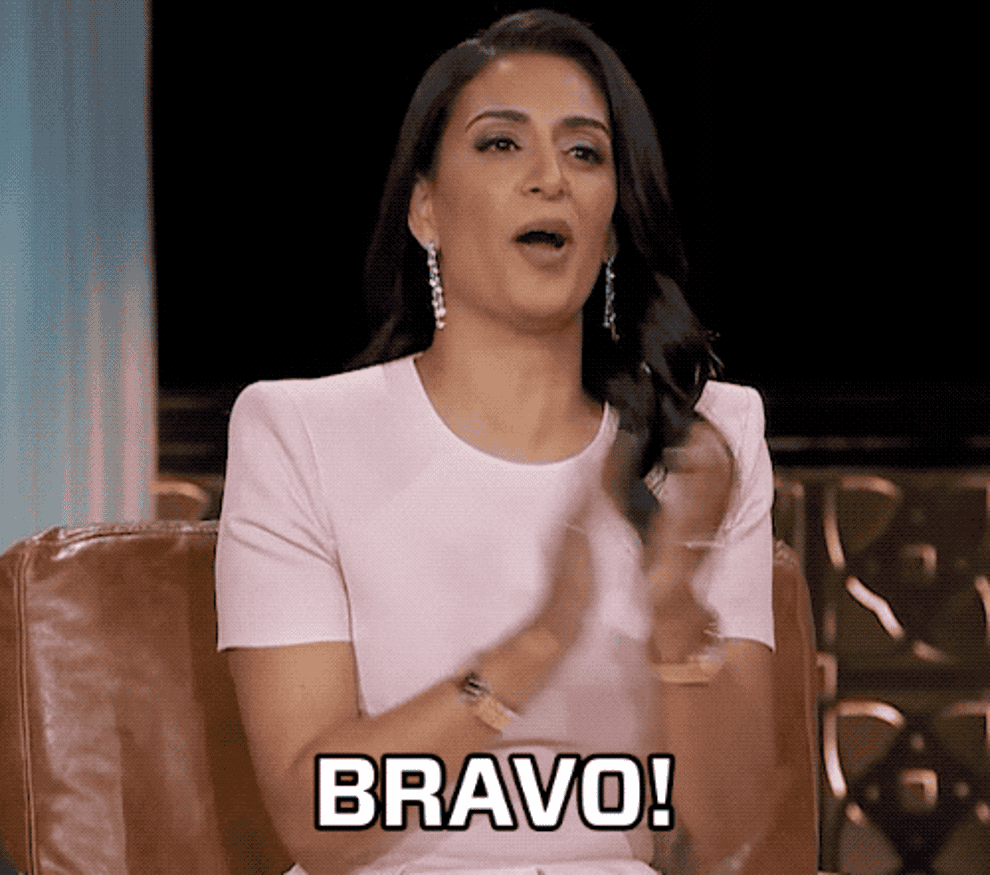 A woman clapping and saying &quot;bravo&quot;