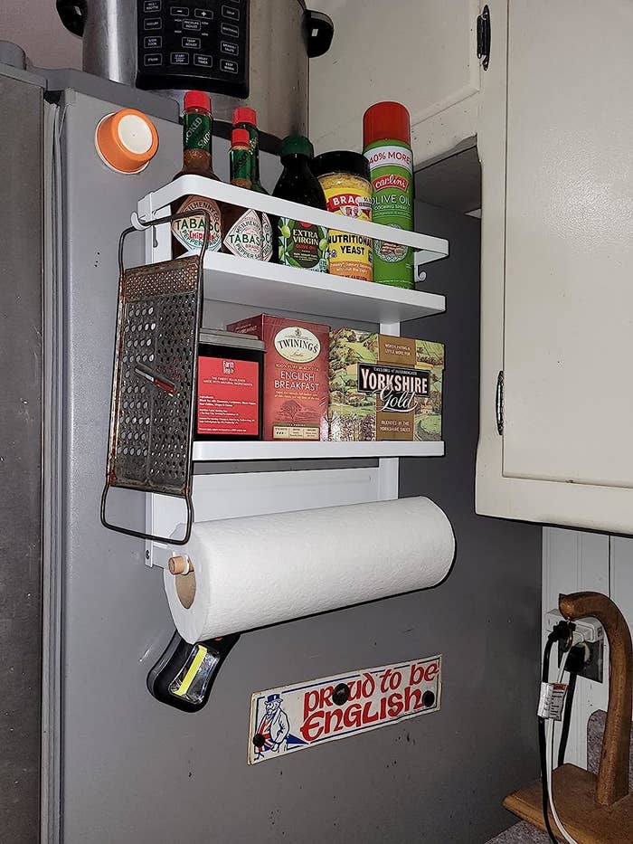 Reviewer image of the magnetic shelf on their fridge