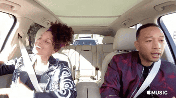 Alicia Keys and John Legend vibing to music in the car