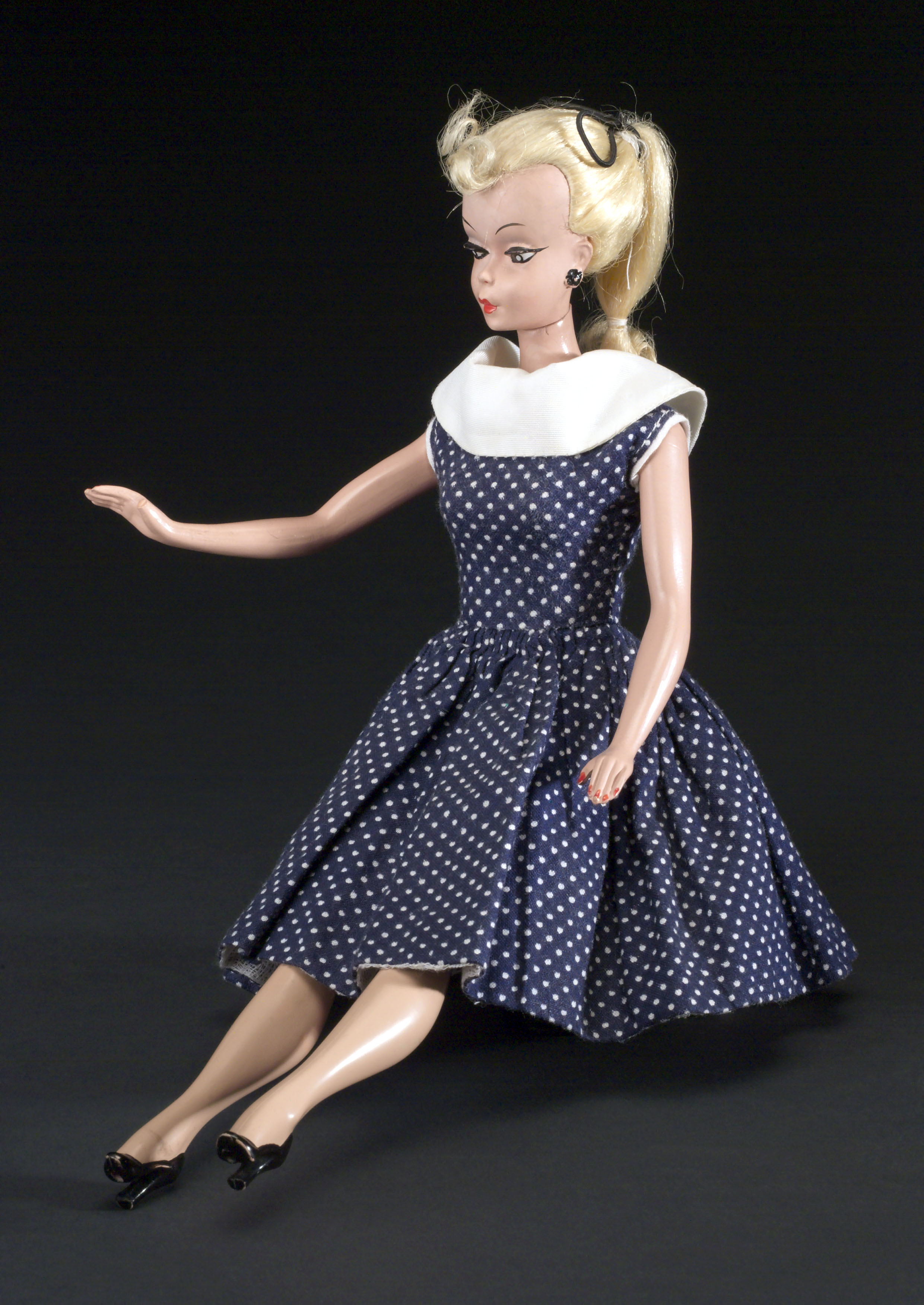 doll in a polka dot dress
