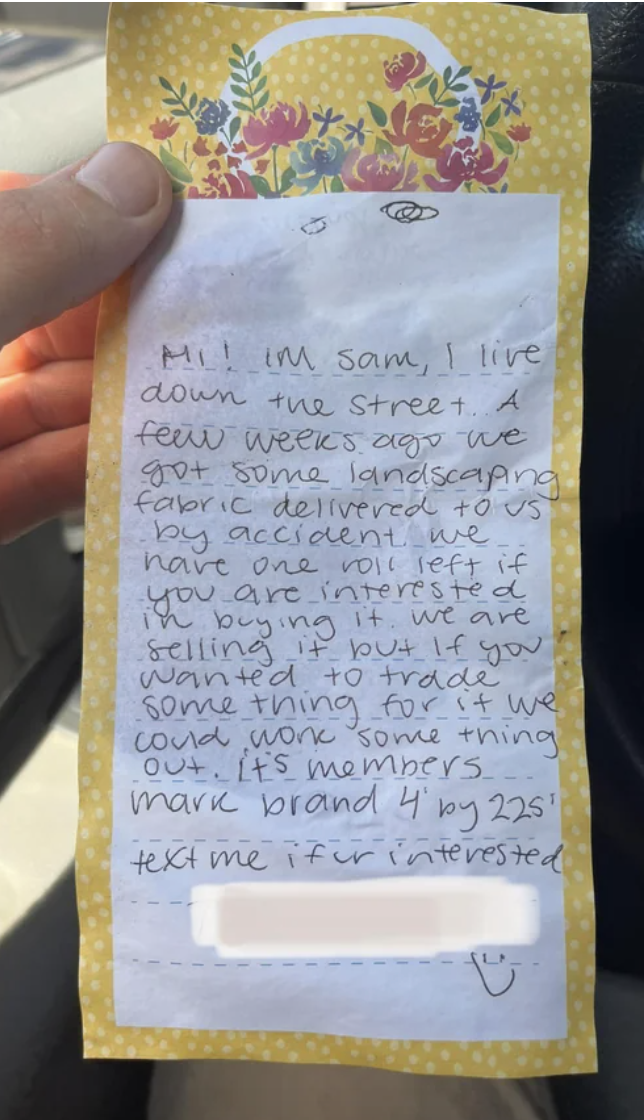 Handwritten note to a neighbor trying to sell them a roll of landscaping fabric that they had delivered to them by mistake