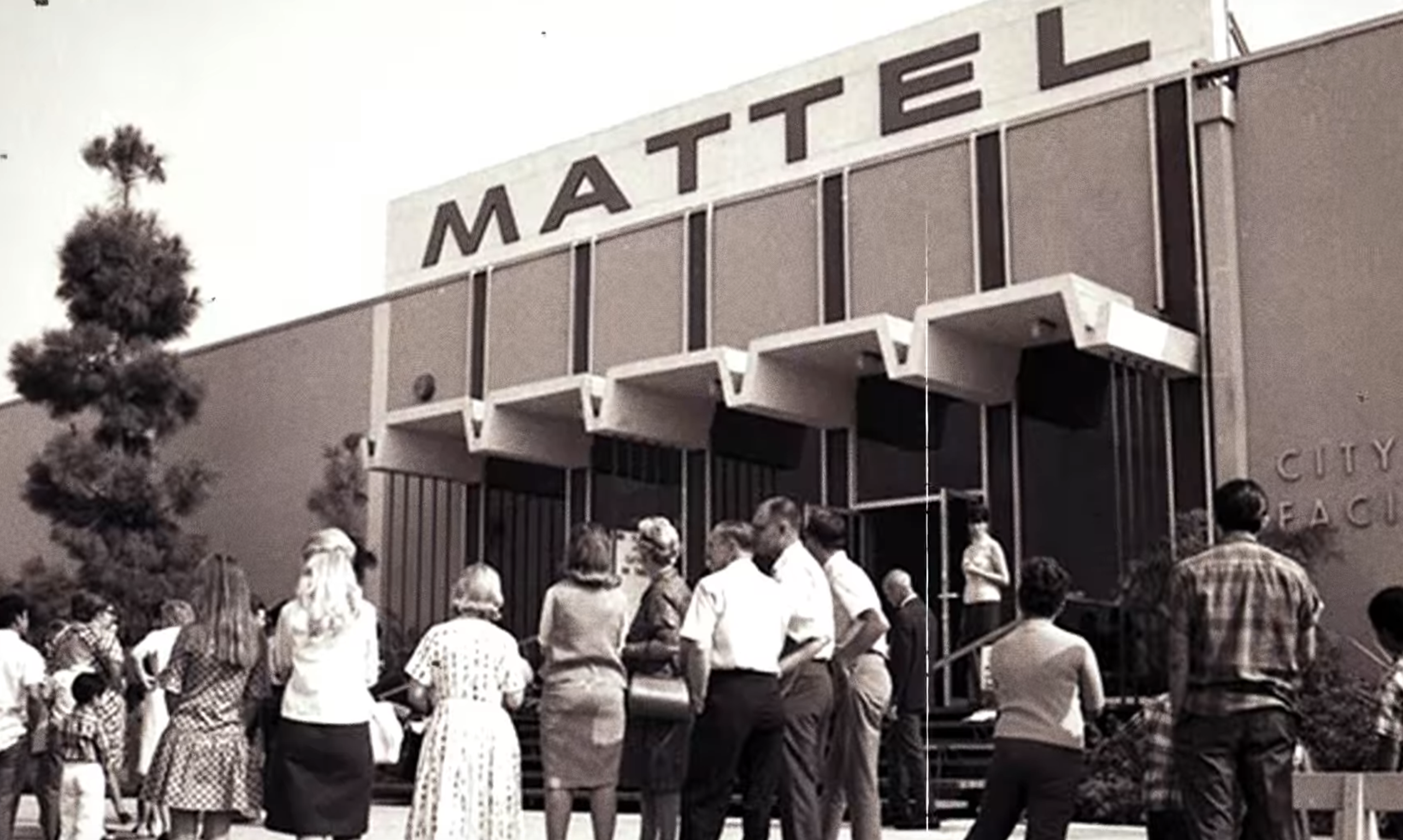 people standing outside the mattel office