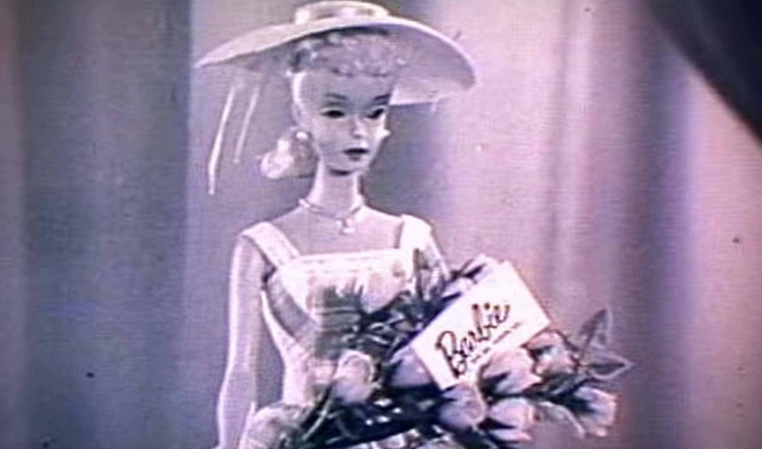 A black-and-white photo of an old-school barbie holding a bouquet