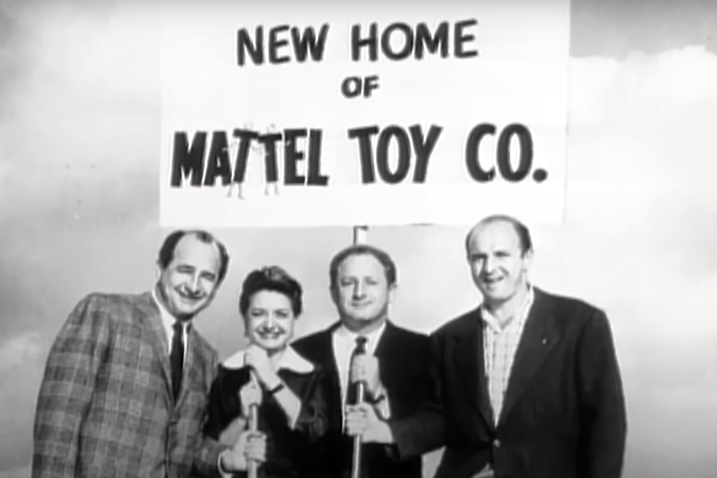 new home of mattel toy co sign above ruth and 3 other board members