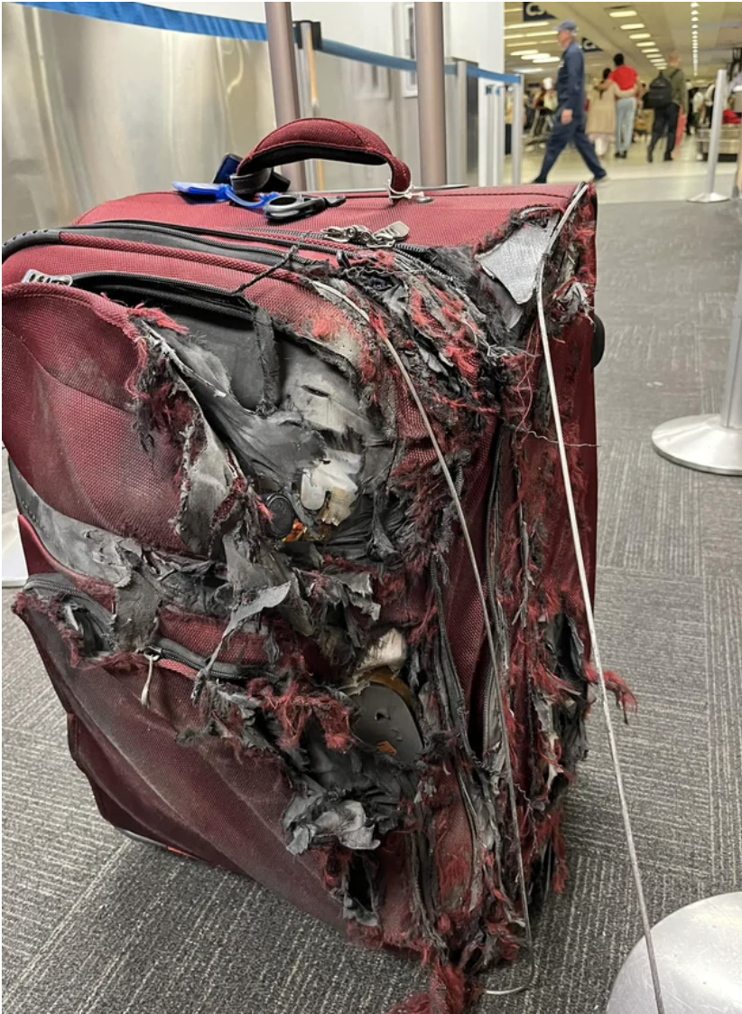 A destroyed piece of luggage