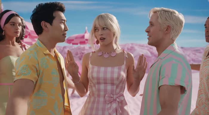 Simu as Ken faces off as Ryan as Ken with Margot Robbie as Barbie in the middle