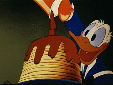 gif of Donald Duck pouring syrup over pancakes