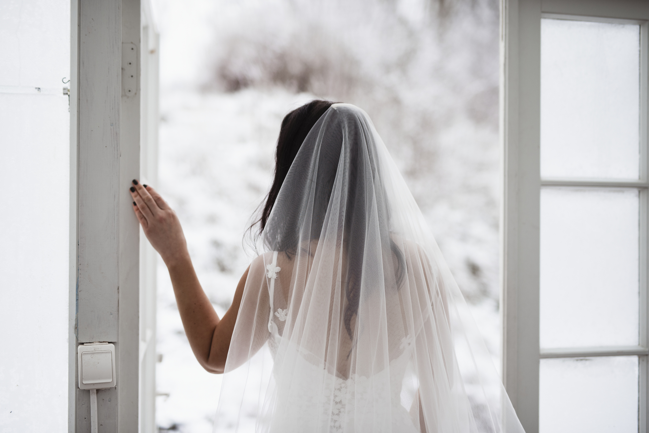 A bride walking through an open door