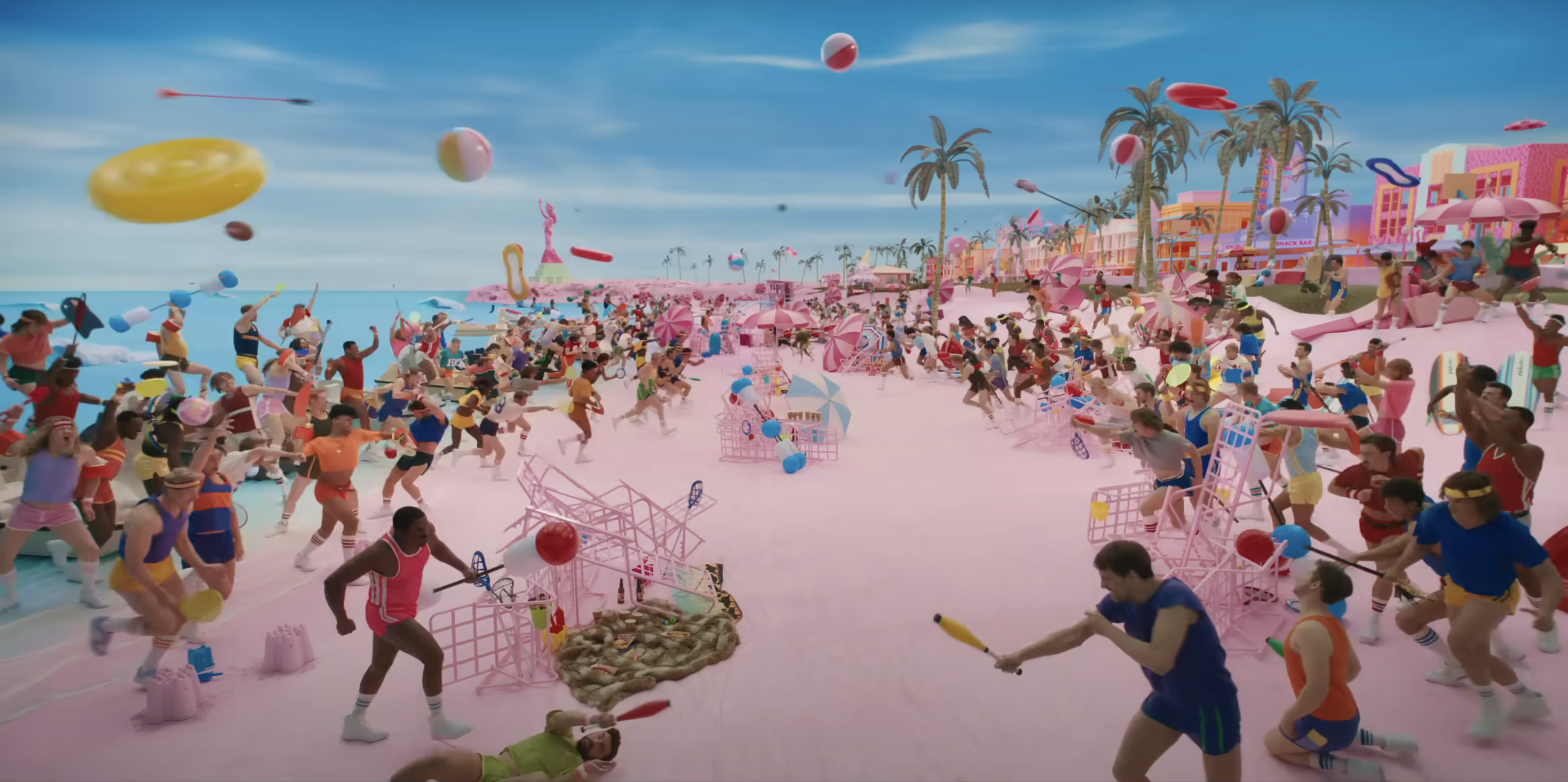 People playing on the pink beach in Barbie