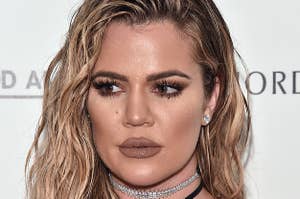 Khloe Kardashian poses on the red carpet