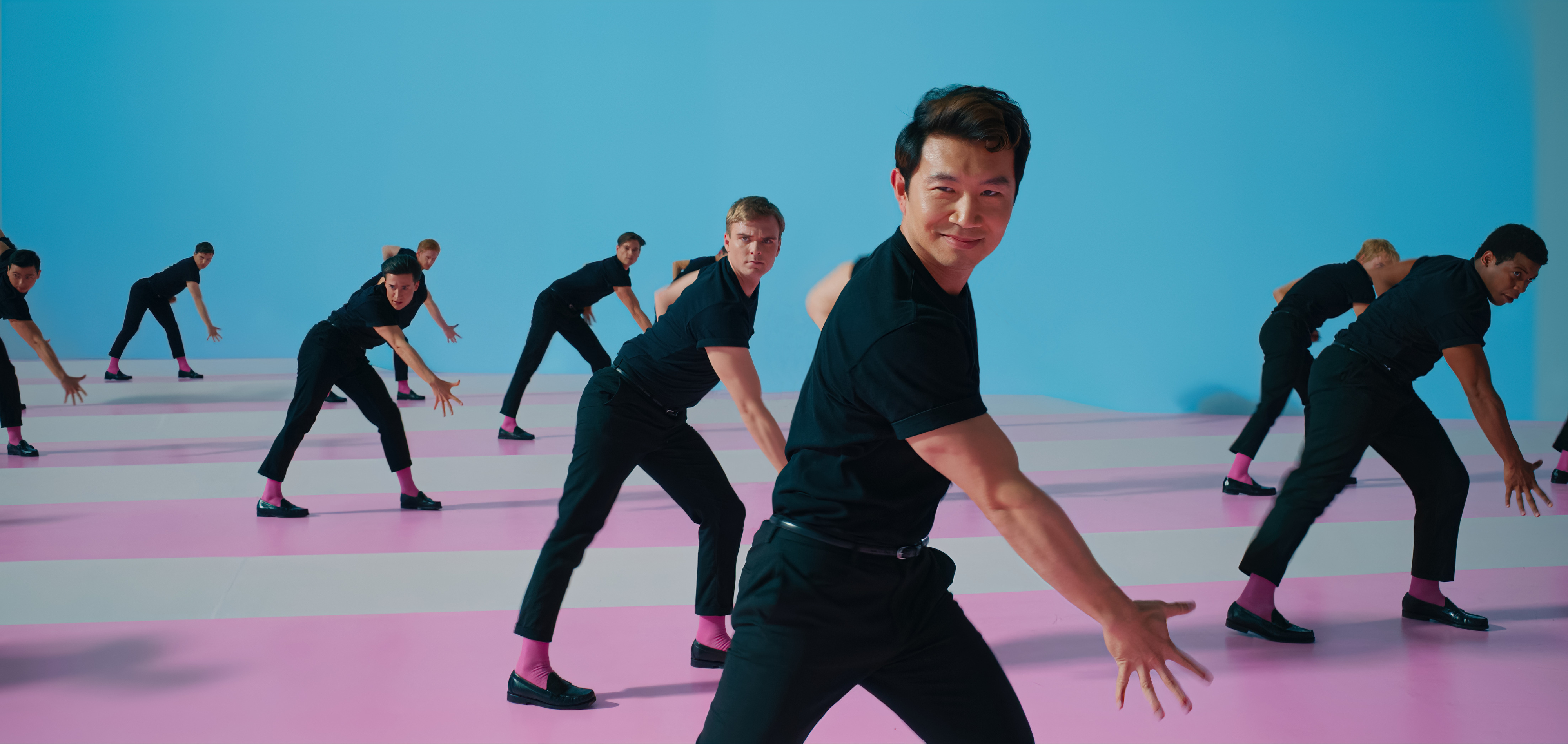 A choreographed dance with Simu Liu as Ken in the front