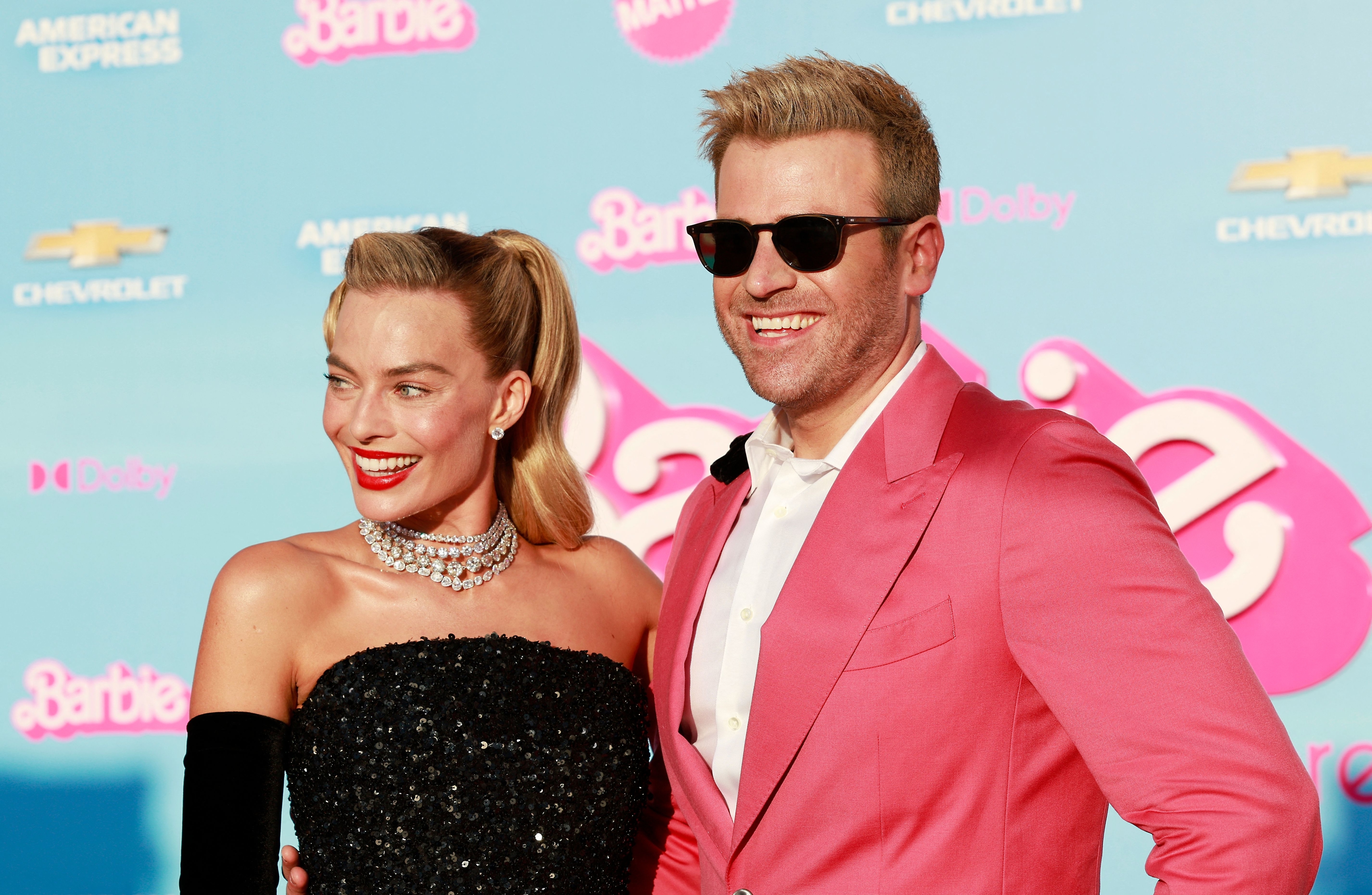 Margot Robbie and Scott Evans at a premiere for Barbie