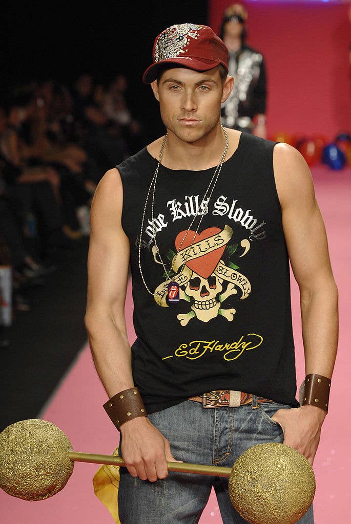 A man modeling Ed Hardy clothes on the runway