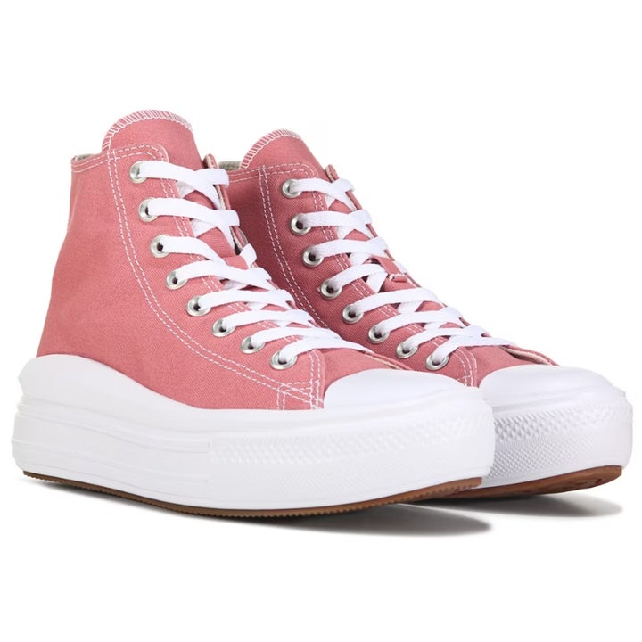 the pink converse sneakers laced up