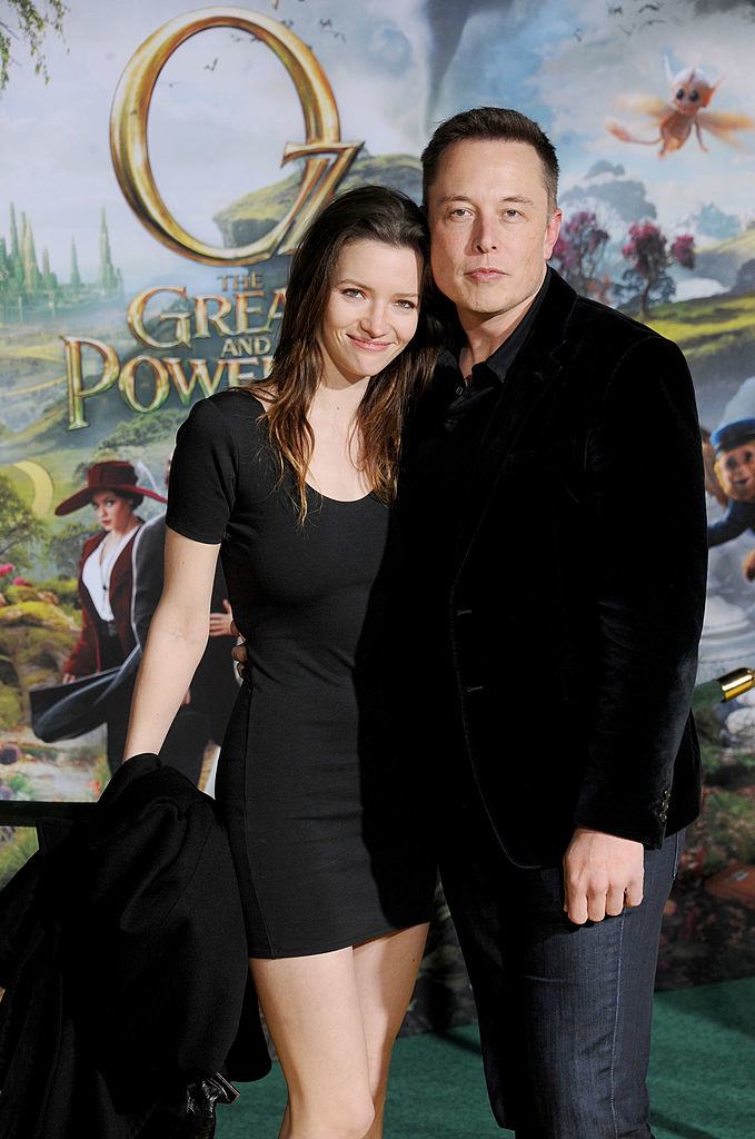 Talulah and Elon hold each other close at a media event