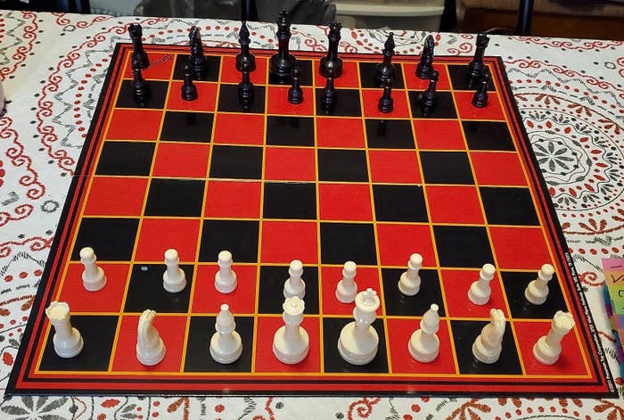 reviewer&#x27;s black and red chess board and black and white pieces