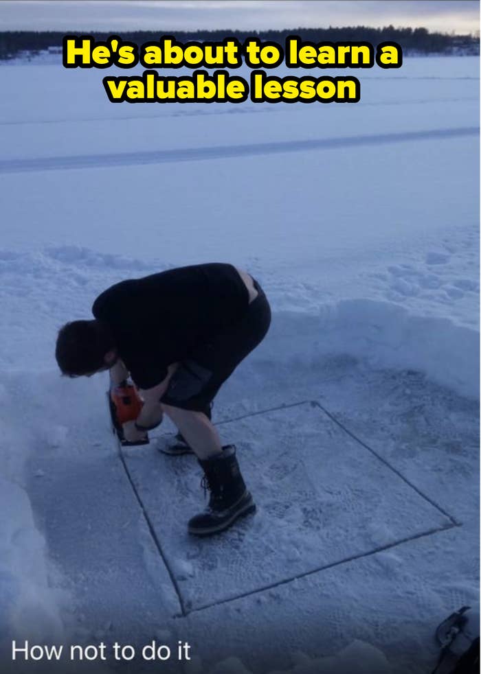 man cutting ice and standing on the piece he's cutting out