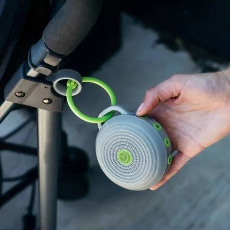 Portable sounds machine hangs on a stroller