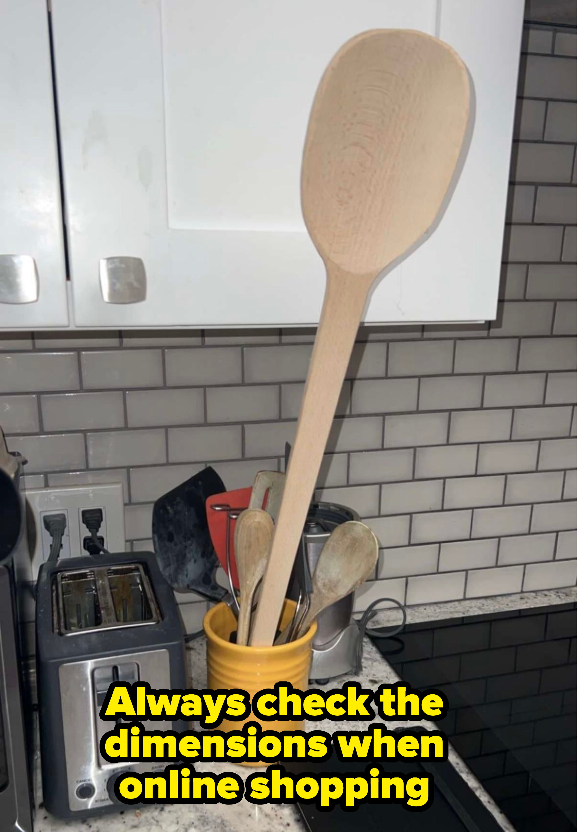 a ridiculously big wooden spoon