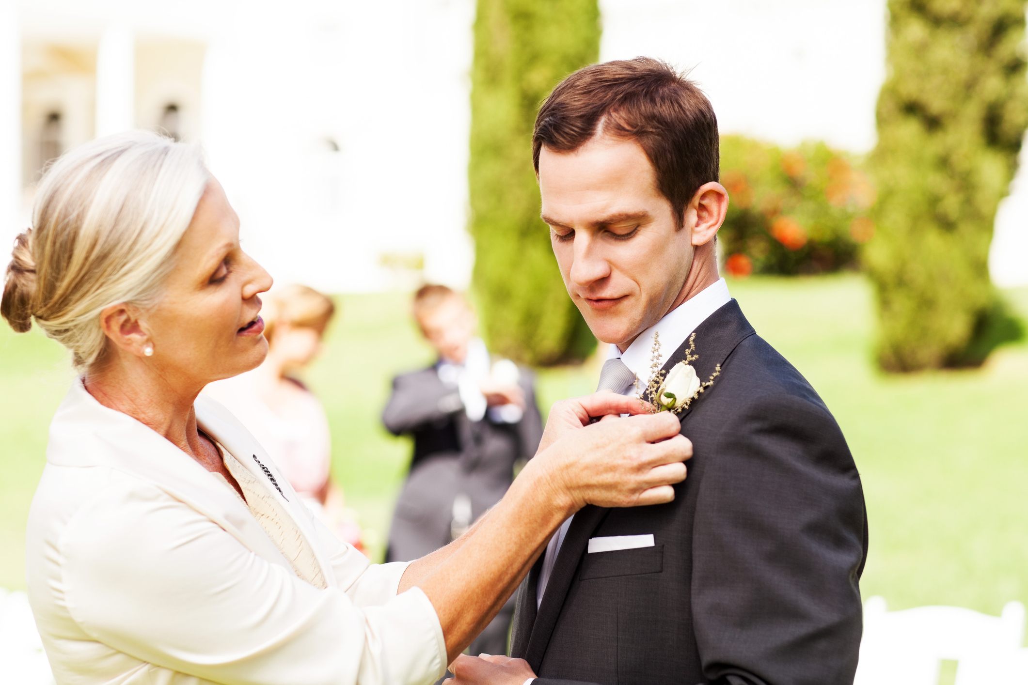 A groom and his mother at a wedding