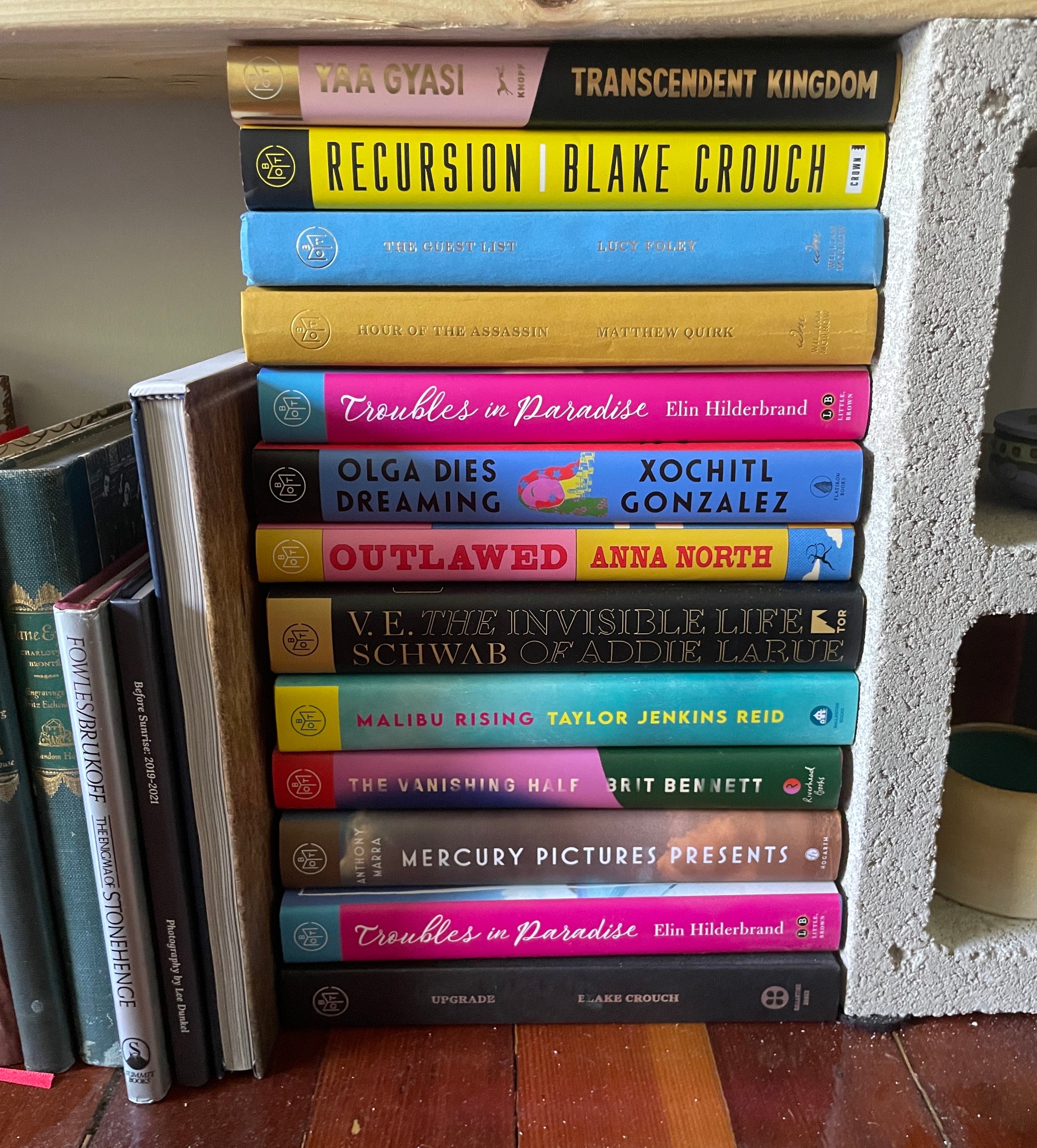 writer&#x27;s stack of Book of the Month titles.