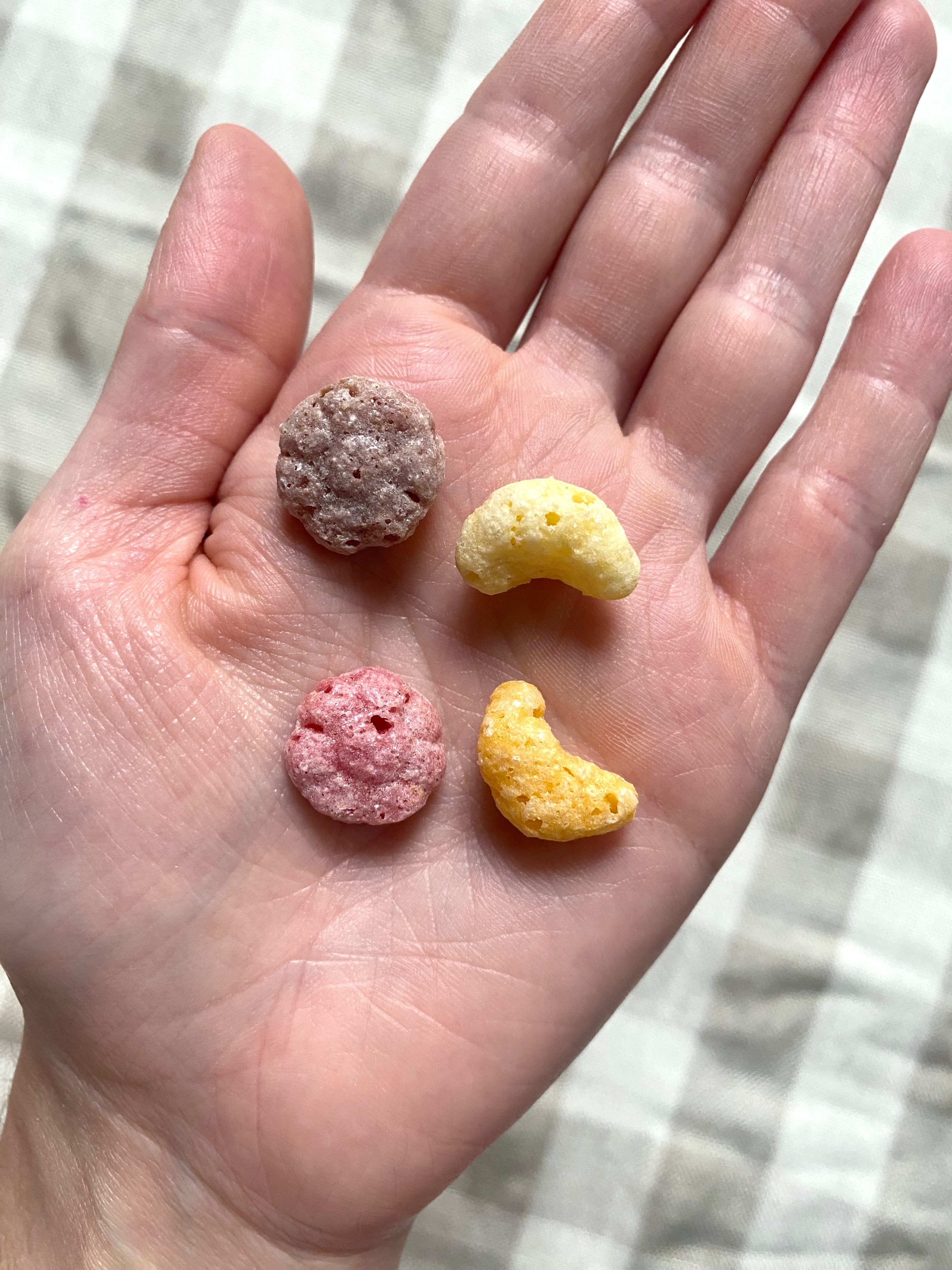 different cereal shapes in Claudia&#x27;s hand
