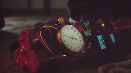 A bomb with a timer strapped to it sits on the ground. The hand on the timer points to a line between 4 and 6 seconds.