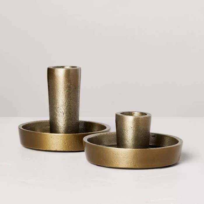 the golden candle holder with a matching base in two sizes