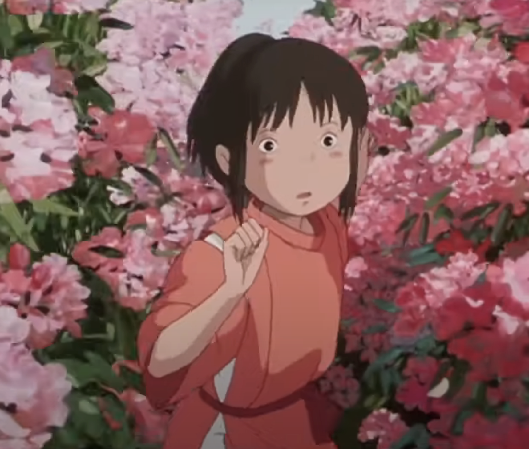Close-up of animated Chihiro against a floral backdrop