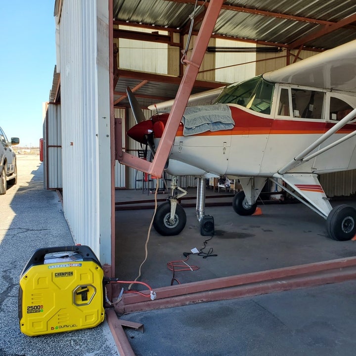 Reviewer's photo of generator in front of plane