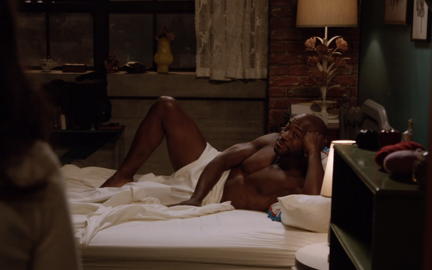 Taye Diggs in bed