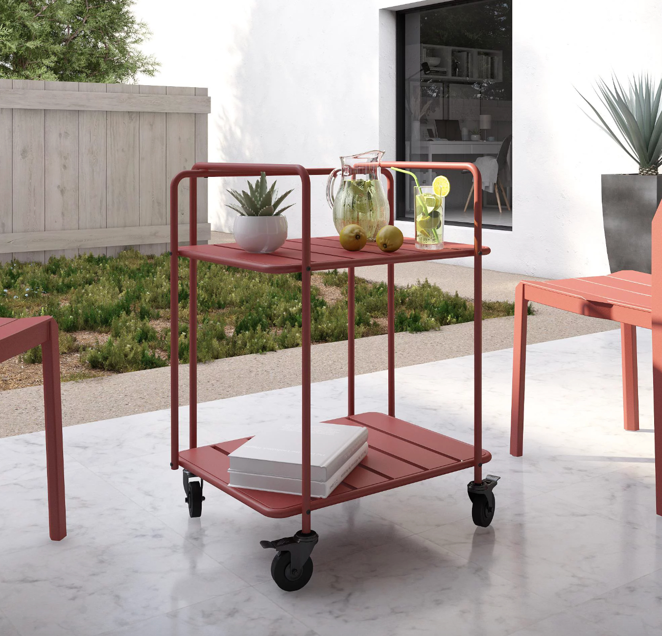 the red steel cart filled with drinks and tchotchkes in a decorated outdoor space