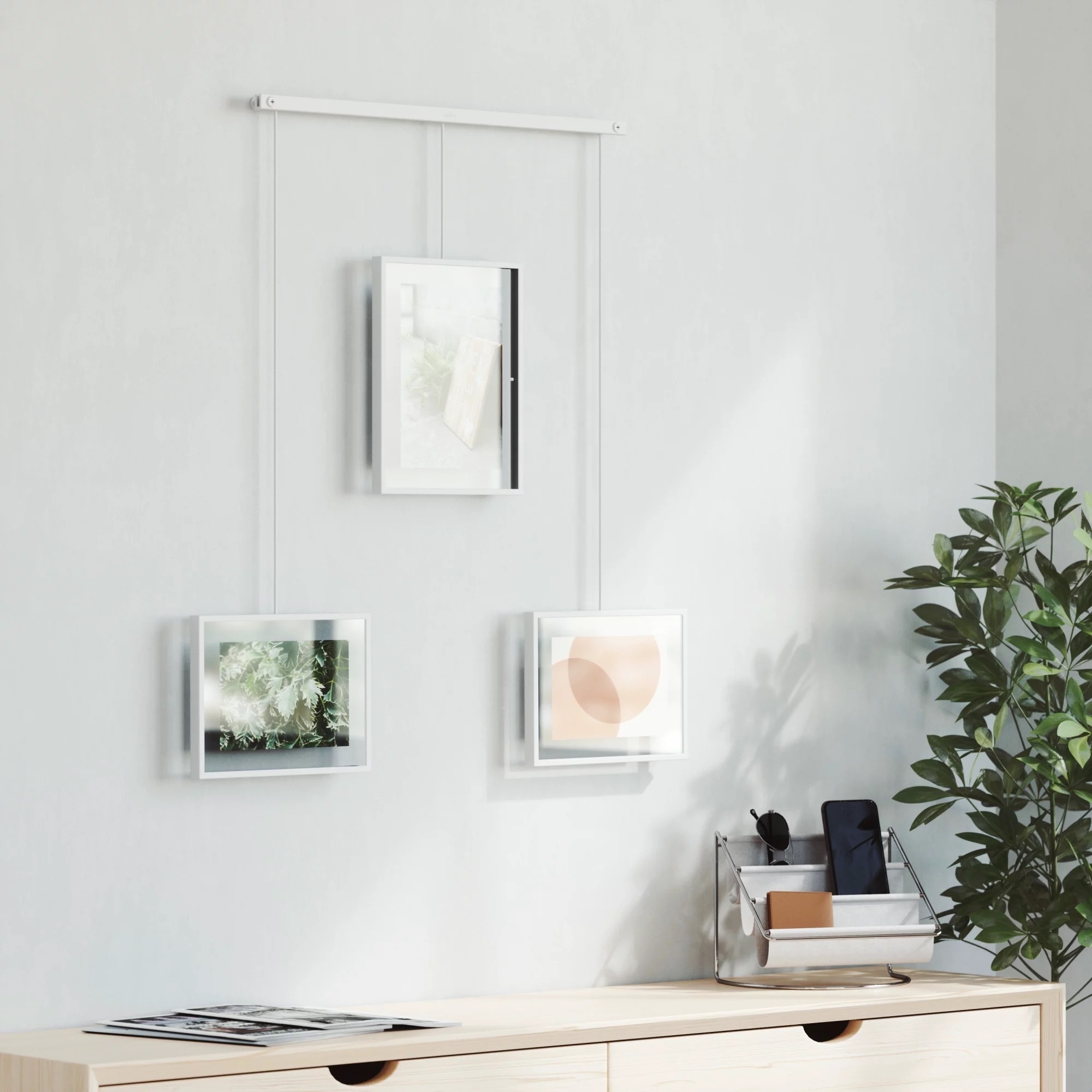The gallery wall set with three frames in the color white