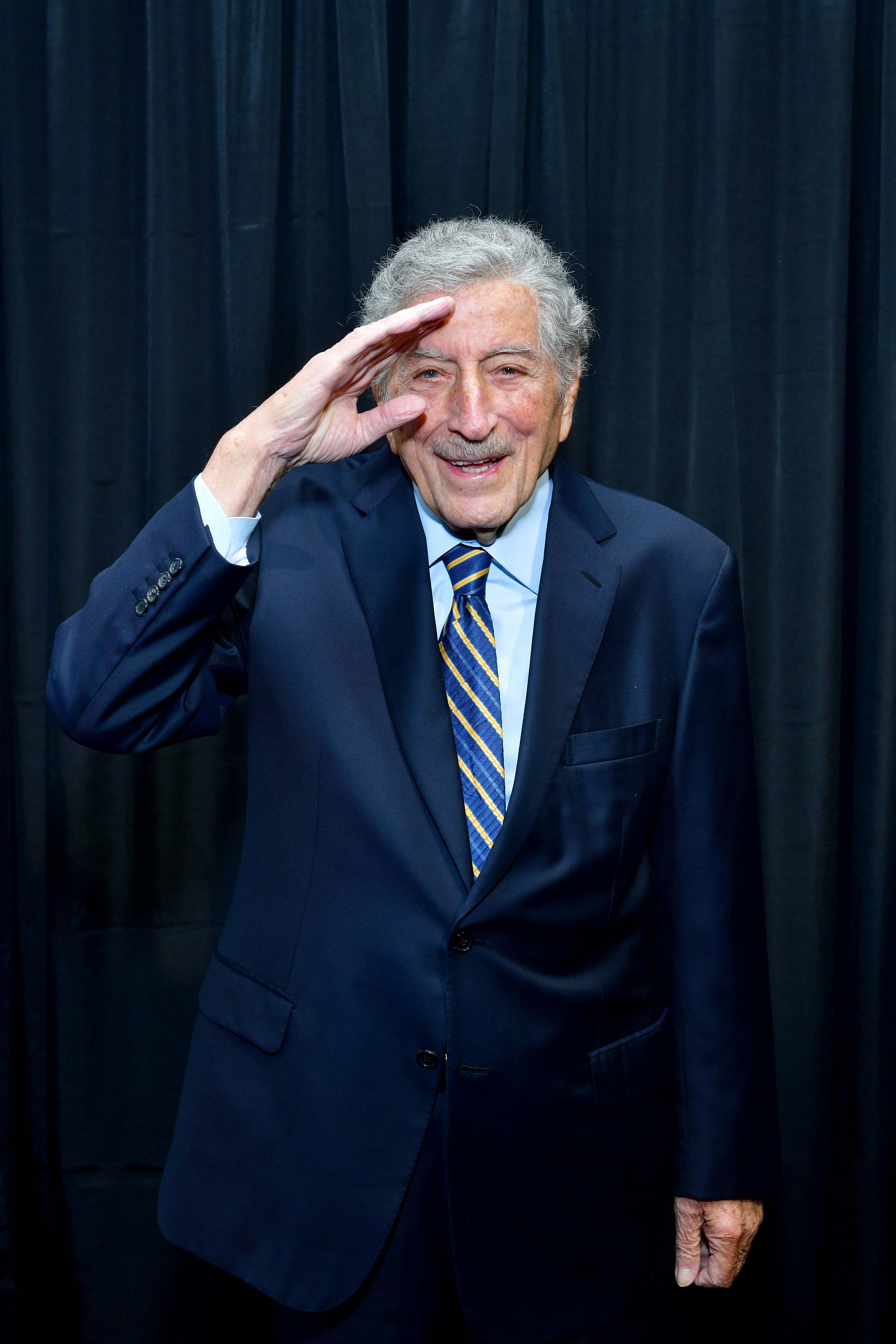 Tony Bennett saluting