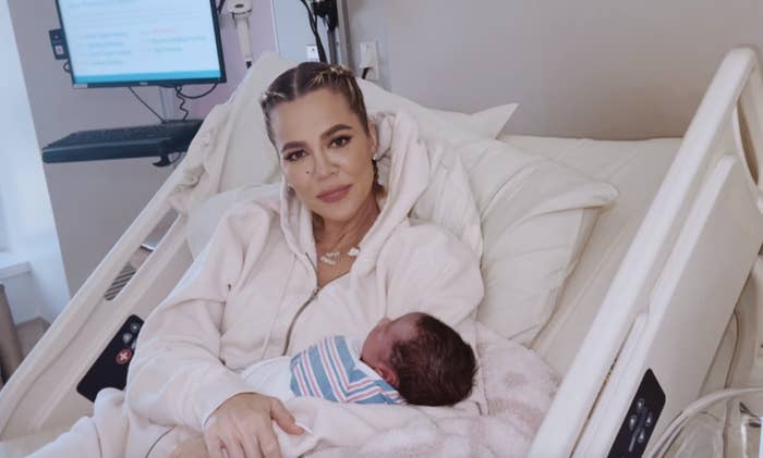 Khloé holding her newborn baby