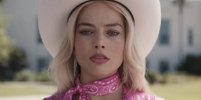 Closeup of Margot Robbie as Barbie in a cowboy hat