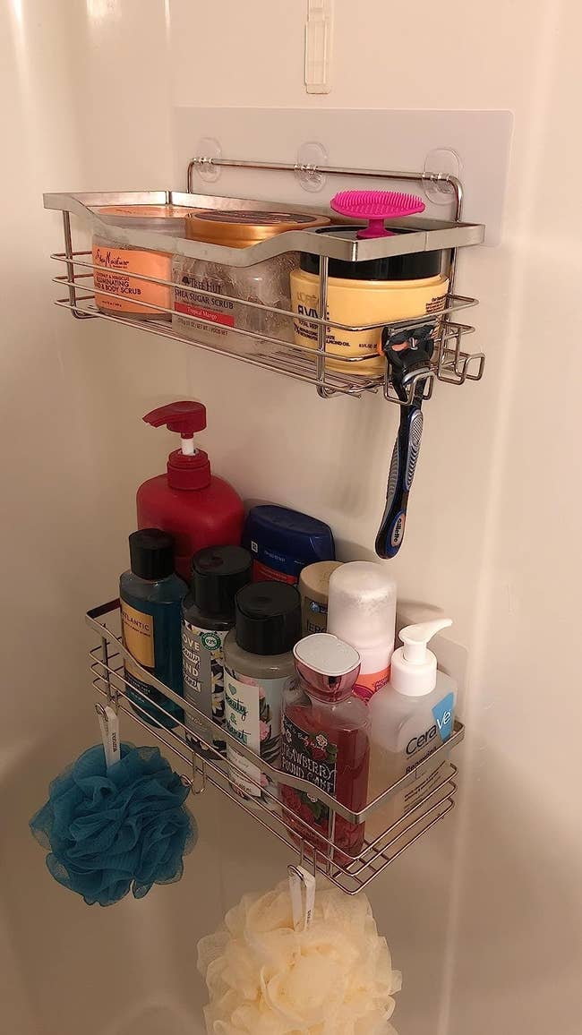 Reviewer's basket caddy with many bottles and loofahs on it