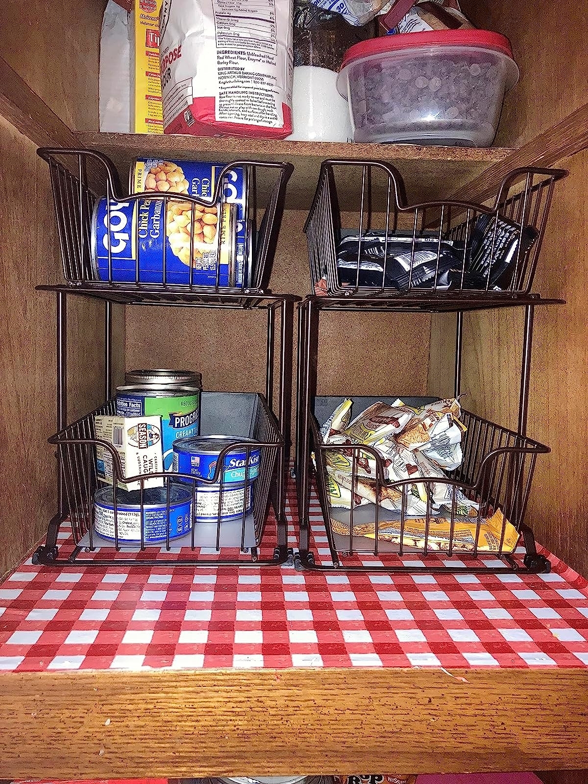 Reviewer image of pantry items inside the wire organizers in a cabinet