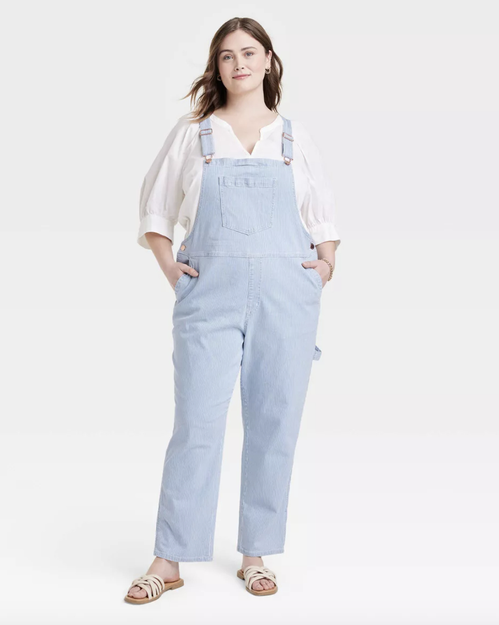A pair of light wash overalls